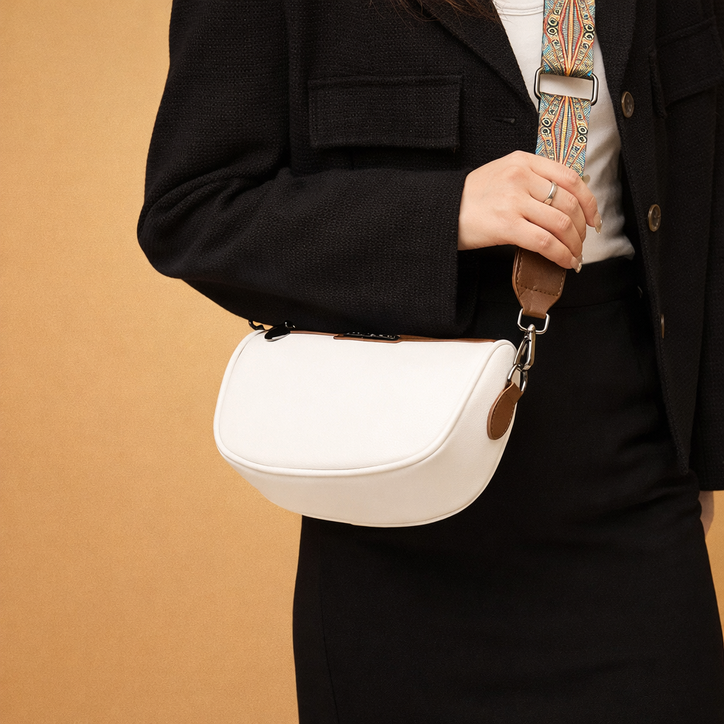 elegant-womens-white-saddle-crossbody-bag-model-shoulder-pose-studio-fashion-shot.png