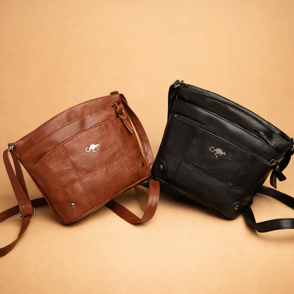 european-fashion-model-crossbody-leather-bag-studio-pose-caramel-sand-background.png