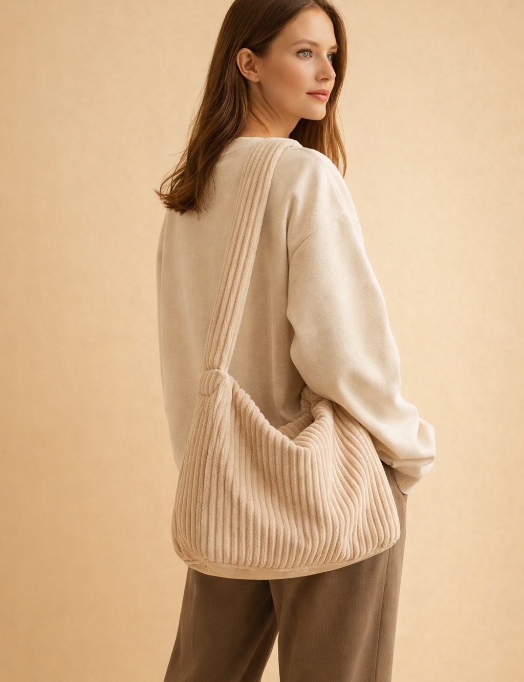 polish-female-model-wearing-beige-ribbed-corduroy-shoulder-bag-studio-fashion-pose.png