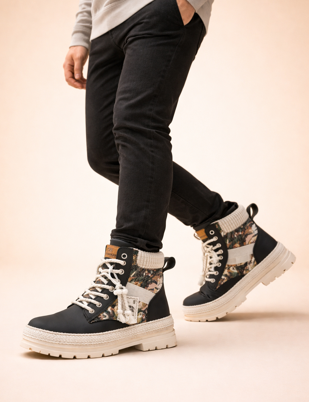 polish-male-model-wearing-black-mixed-textile-high-top-boots-studio-pose.png