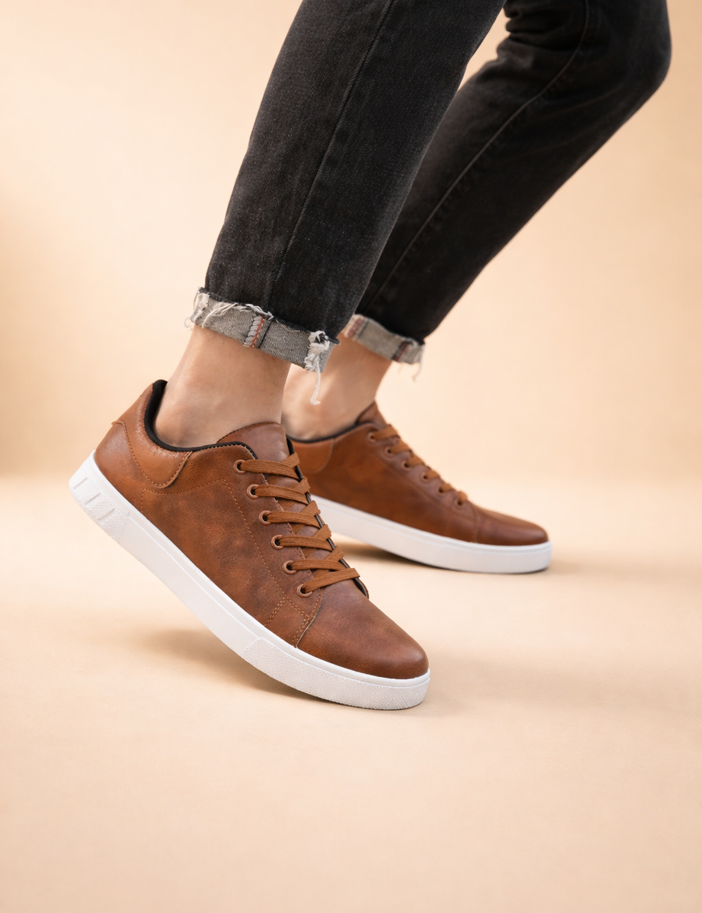 polish-male-model-wearing-brown-leather-sneakers-european-studio-pose-caramel-sand-background.png