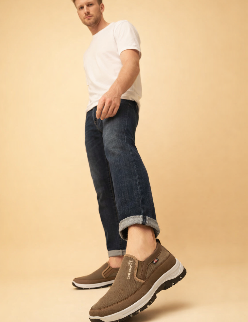 polish-male-model-wearing-brown-slip-on-shoes-european-studio-posed-shot.png