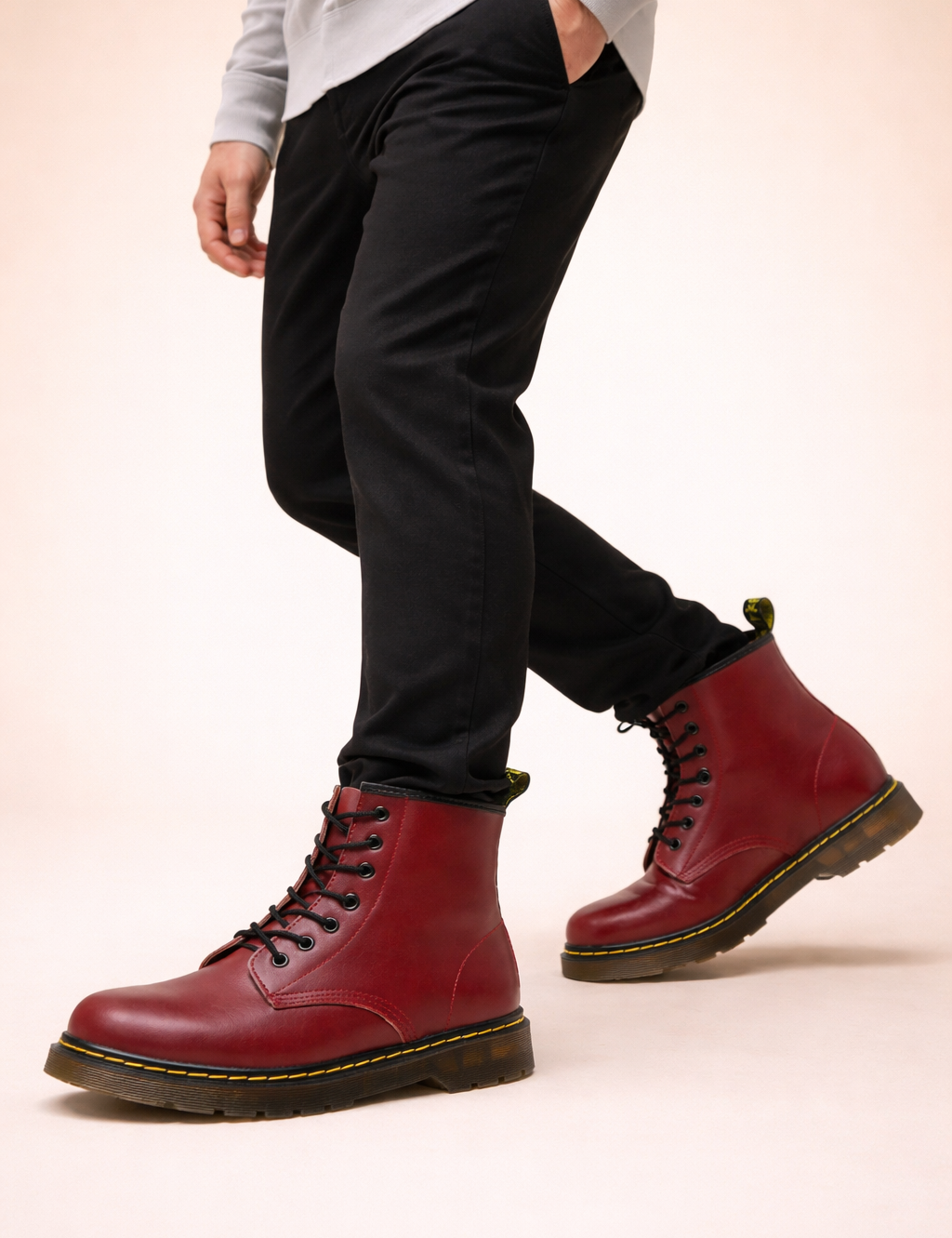polish-male-model-wearing-cherry-red-leather-lace-up-boots-studio-pose.png