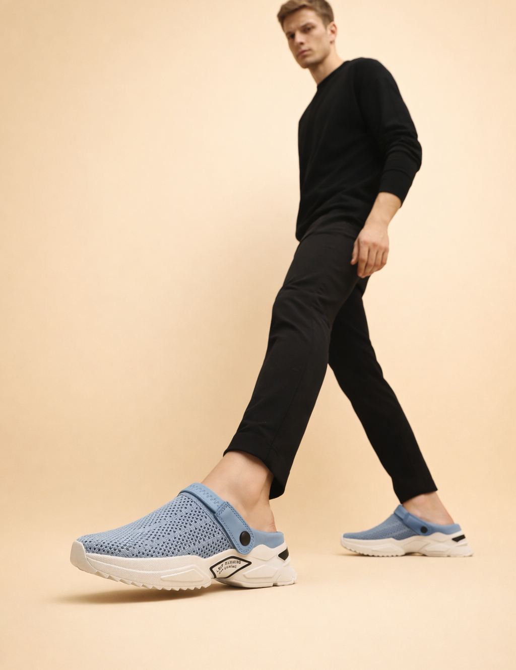 polish-male-model-wearing-light-blue-knit-slip-on-sneakers-european-studio-shot.png
