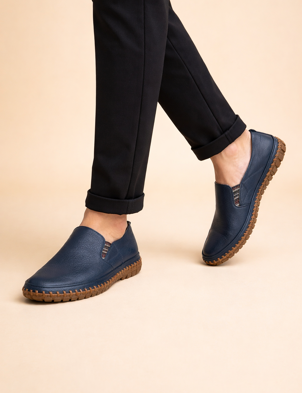 polish-male-model-wearing-navy-leather-slip-on-loafers-european-studio-posed-shot.png