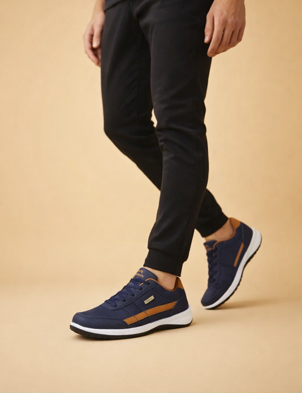 polish-male-model-wearing-navy-tan-sneakers-european-studio-posed-shot.png