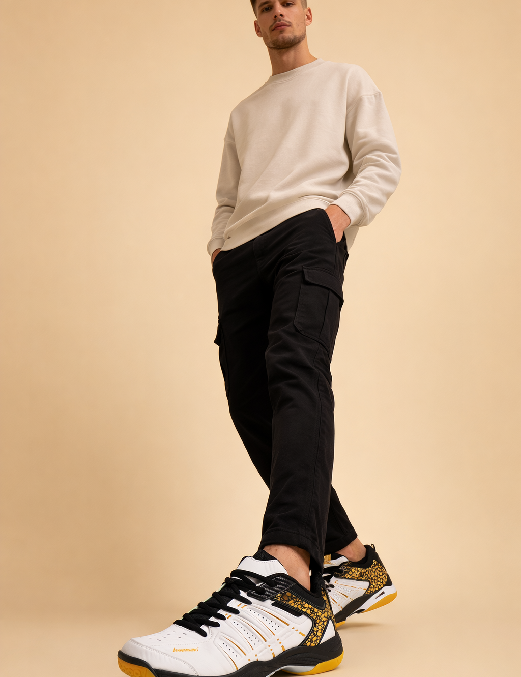 polish-male-model-wearing-white-black-gold-sneakers-european-studio-step-forward-pose.png