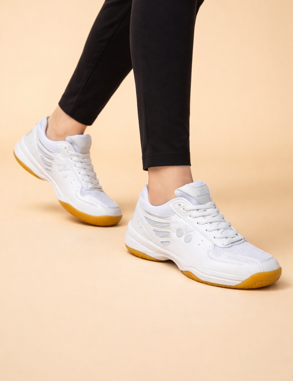 white-yonex-court-sneaker-model-studio-shot-caramel-sand-backgrou.png